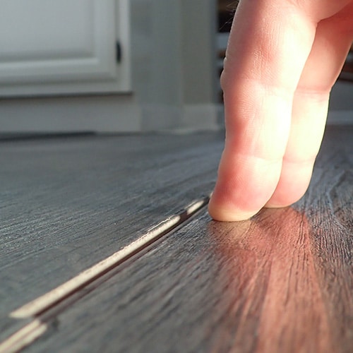 deflecting and separating vinyl plank sides